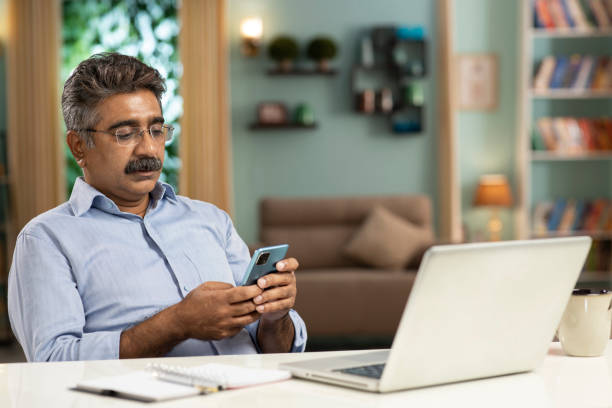 istock mature man working from home stock photo 1354158865