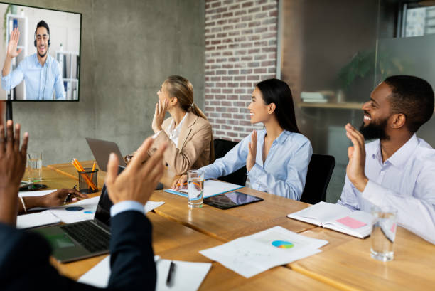 istock Videoconference Concept. Multiethnic business people making video call with colleague in office 1354161080