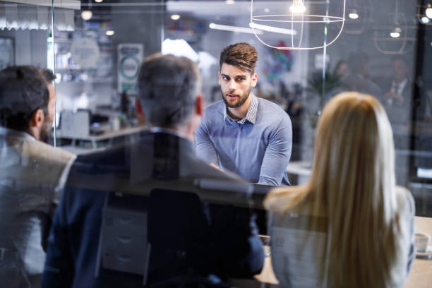 istock Male candidate talking to human resource team on job interview. 1354161153