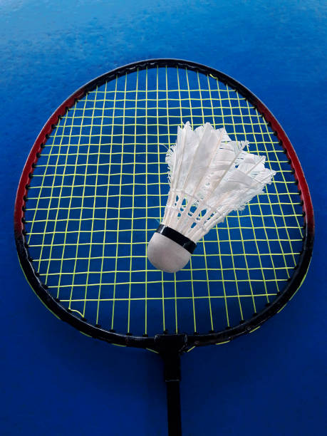 istock Badminton racket and shuttlecock on blue background 1354161449