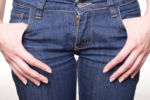 istock blue jeans on girl with arms in pockets 135416196