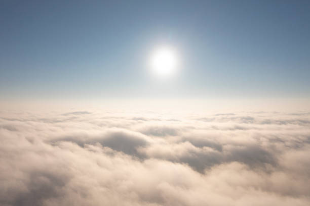 Aerial view white clouds in blue sky. View from drone. Aerial top view cloudscape. Texture of clouds. View from above. Panorama sky