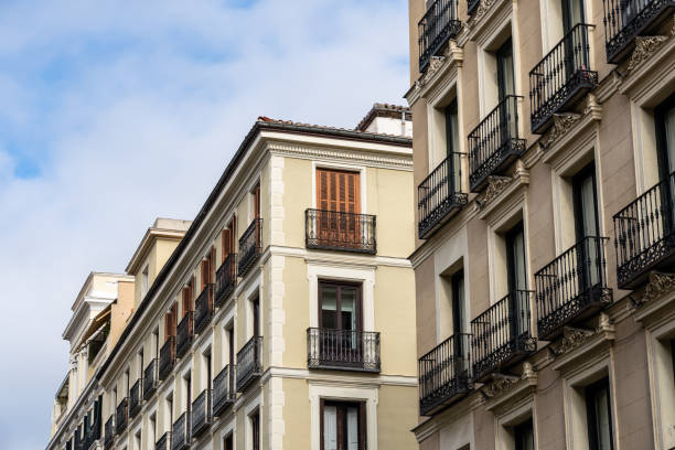 istock Old residential building facade against sky in Madrid 1354162701
