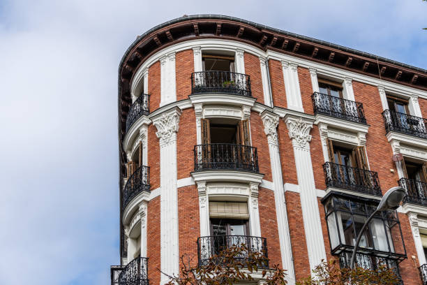 istock Old residential building facade against sky in Madrid 1354162712