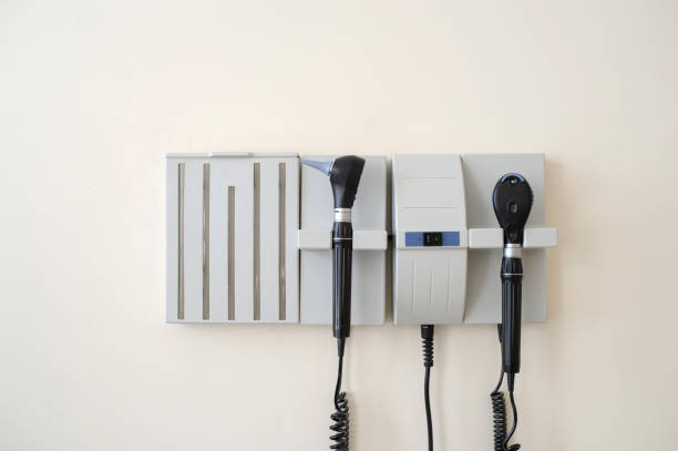 istock otoscope and ophthalmoscope hanging on a doctor's office wall 1354162805