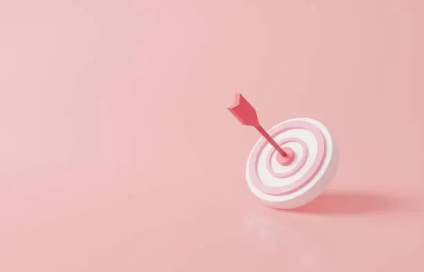 Photo of Arrow hit the center of target on pink pastel background. Business finance target concept.3d render success of the arrow bow to the target. Marketing time concept. 3d rendering illustration. Minimal