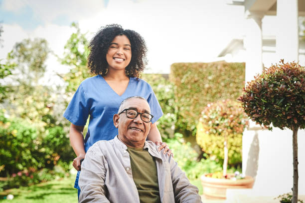 istock Shot of a young nurse bonding with her senior patient outside 1354166340