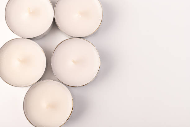 istock Many wax candles together on the white background. Space for text 1354166685