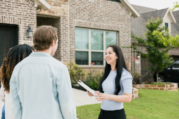 istock Real Estate Agent shows home to couple 1354166819