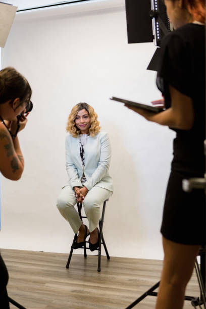 istock Female media personality sits for head shots in studio 1354169876