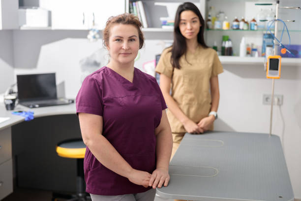 istock confident doctors in modern veterinary clinic 1354170650