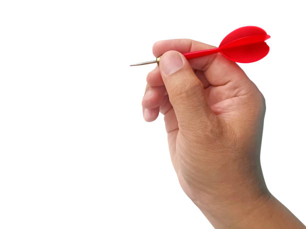 istock hand holding darts arrow isolated on white background. concept marketing target 1354171126