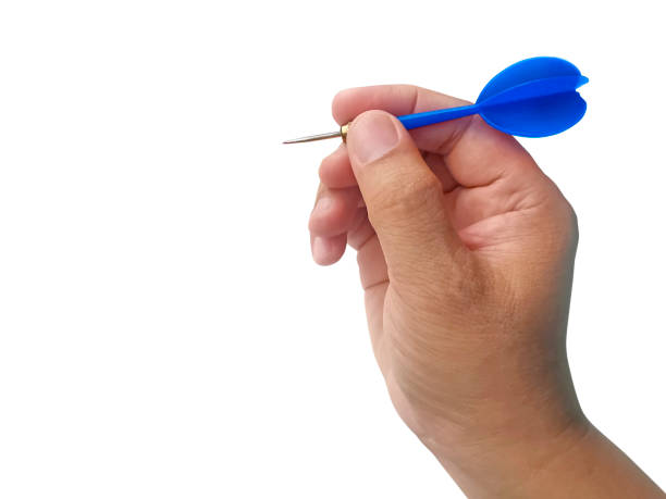 istock hand holding darts arrow isolated on white background. concept marketing target 1354171133