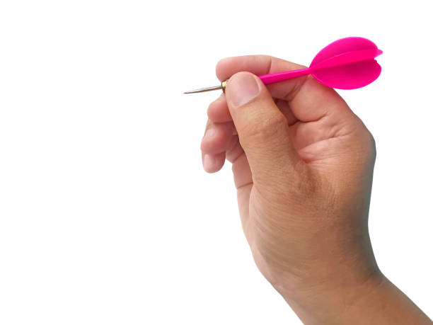 istock hand holding darts arrow isolated on white background. concept marketing target 1354171179