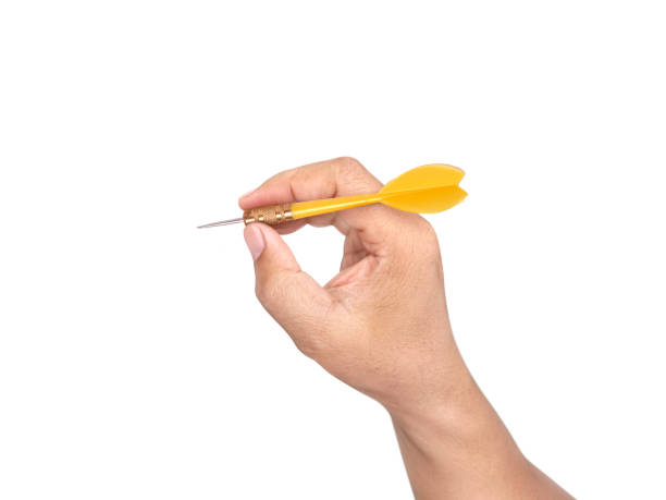 istock hand holding darts arrow isolated on white background. concept marketing target 1354171298