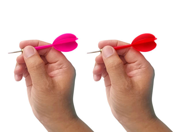 istock hand holding darts arrow isolated on white background. concept marketing target 1354171322