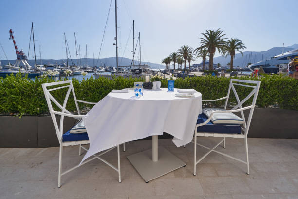 istock A table in a outdoor restaurant with white tablecloth 1354171330