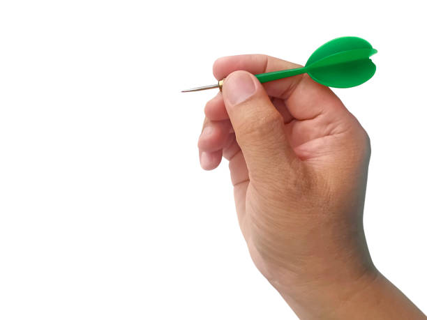 istock hand holding darts arrow isolated on white background. concept marketing target 1354171337