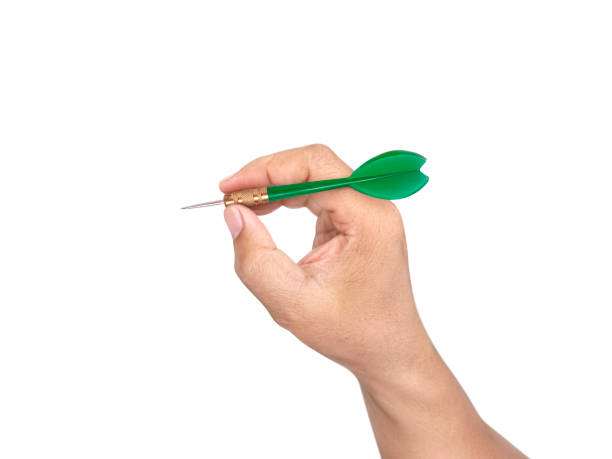 istock hand holding darts arrow isolated on white background. concept marketing target 1354171374