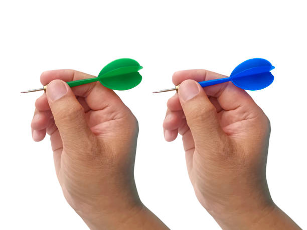 istock hand holding darts arrow isolated on white background. concept marketing target 1354171402