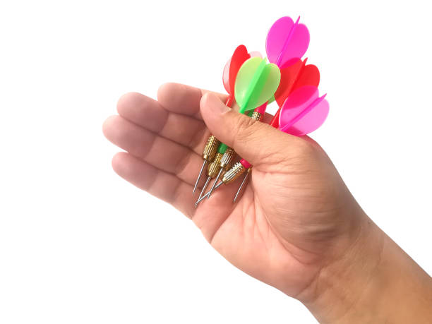 istock hand holding darts arrow isolated on white background. concept marketing target 1354171500