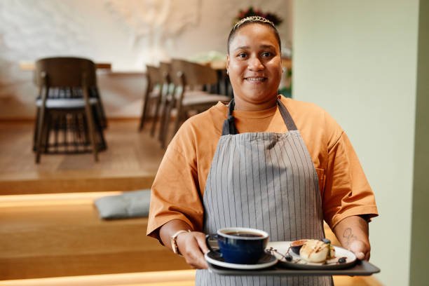 istock Waitperson Holding Tray With Order 1354172499
