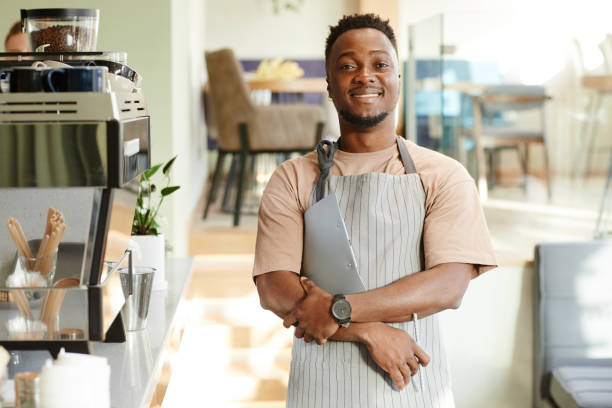 istock Man Working In Cafe Portrait 1354172524
