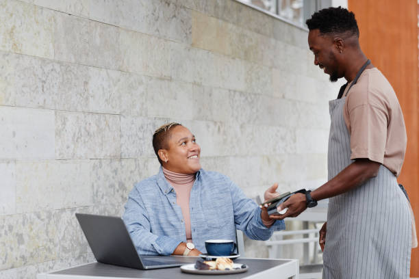 Woman Paying For Lunch