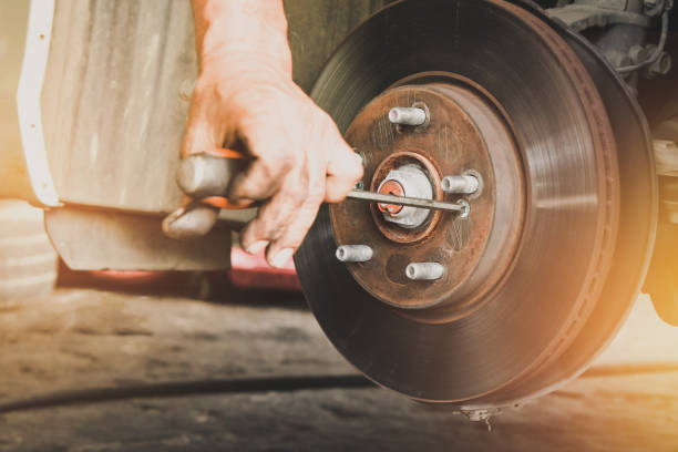 istock The mechanics remove the car disc brake with a screwdriver 1354172637