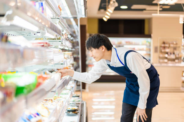 istock Young staffs working at a supermarket 1354173366