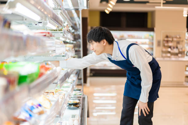 istock Young staffs working at a supermarket 1354173377