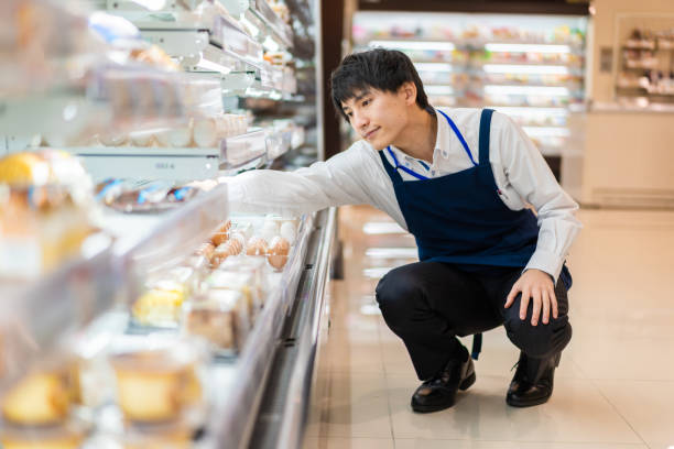 istock Young staffs working at a supermarket 1354173378