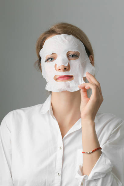 istock Cosmetic mask on the face close up 1354173947