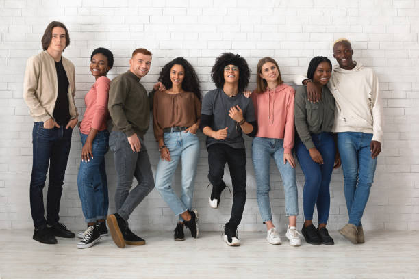 istock Multiracial group of cheerful young people posing over white 1354174083