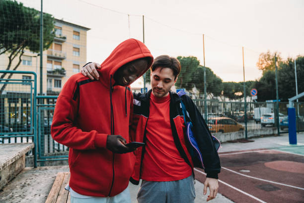 istock Two friends are resting after a basketball match 1354175171