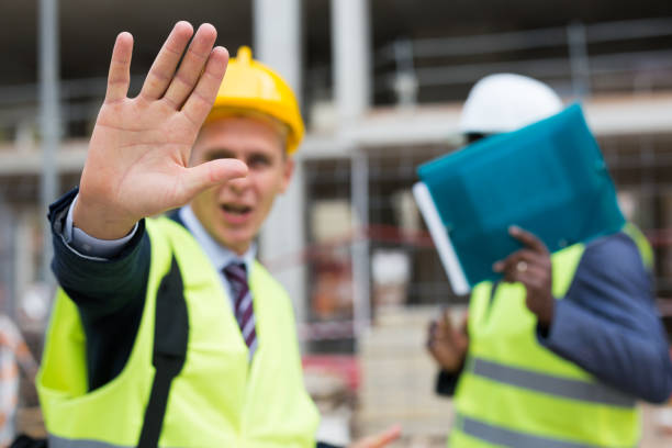istock Engineers hiding their faces in front of camera 1354175332