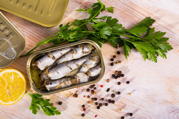 istock Tin can with smoked sprats, sardines, closeup 1354175410
