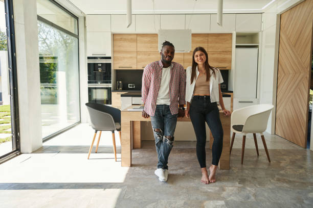 istock Tranquil man and joyful woman posing for camera in kitchen 1354175696