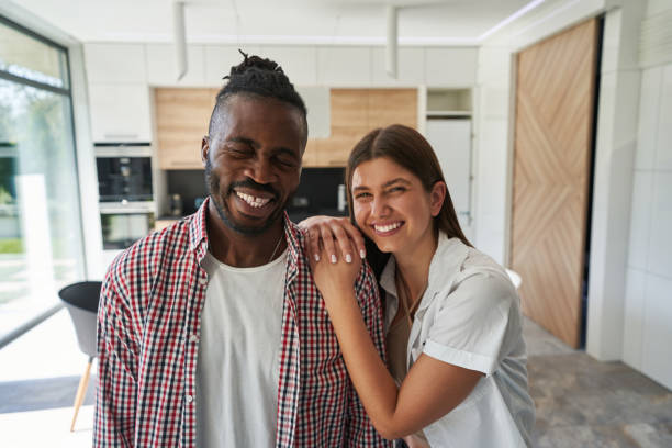 istock Smiling lady leaning on shoulder of cheerful man 1354175701