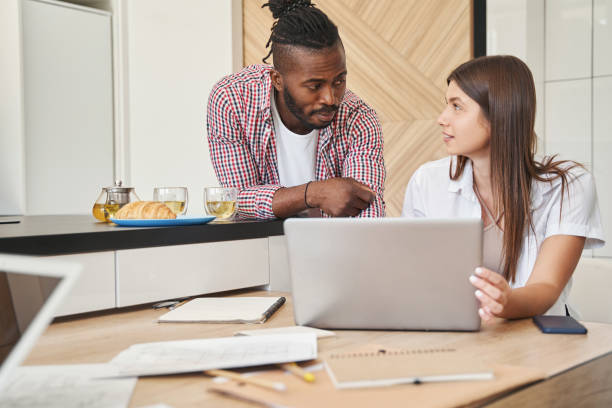 istock Serene man and pleased lady looking at each other 1354175755