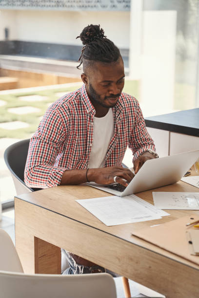 istock Focused young man working on his laptop 1354175758