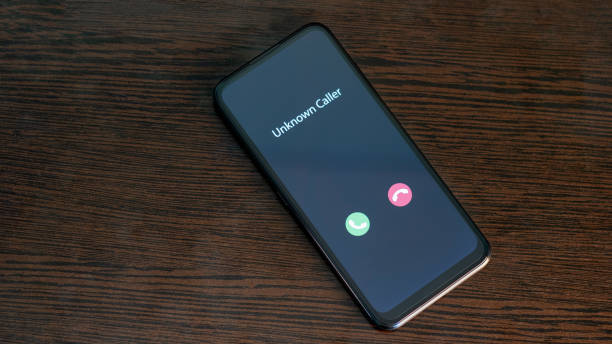 Unknown caller. Smartphone with incoming call from an unknown number. Incognito or anonymous stock photo