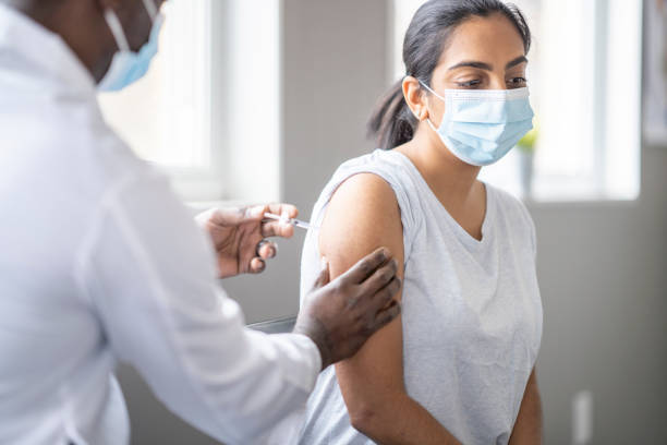 istock Woman Receiving a Vaccination 1354178521