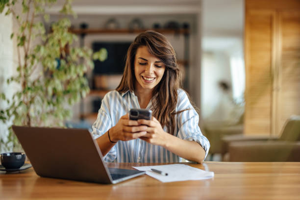 istock Cheerful caucasian woman, sending a text 1354178928