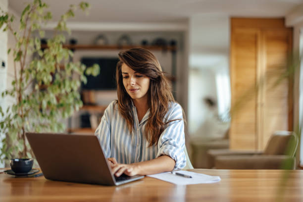 istock Hardworking caucasian woman, using her laptop 1354178930