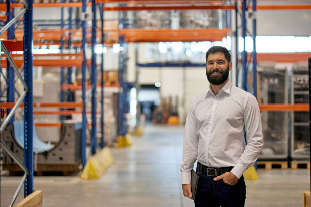 istock Portrait of smiling manager, enjoying his day at work 1354179058