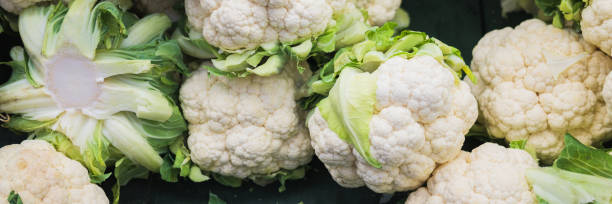 Banner of fresh cauliflower on the counter in a supermarket, market, greengrocery. stock photo