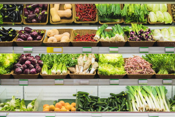 istock Fresh vegetables on supermarket shelves with empty price tags. 1354179180