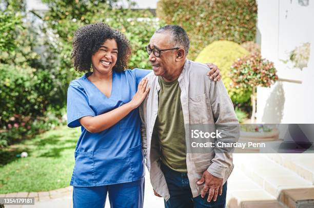 Shot Of An Attractive Young Nurse Bonding With Her Senior Patient Outside Stock Photo - Download Image Now
