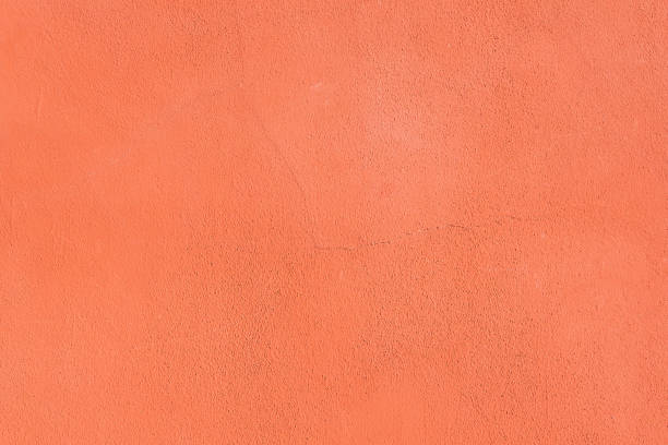 istock Concrete pink colorful wall surface texture. Abstract grunge bright color background with aging effect. Copyspace. 1354179191